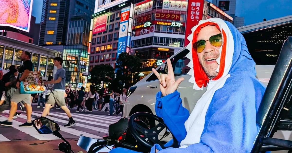 Small convoy of go-karts at a photo stop on a Shibuya Crossing go-kart tour with photos in Tokyo, Japan